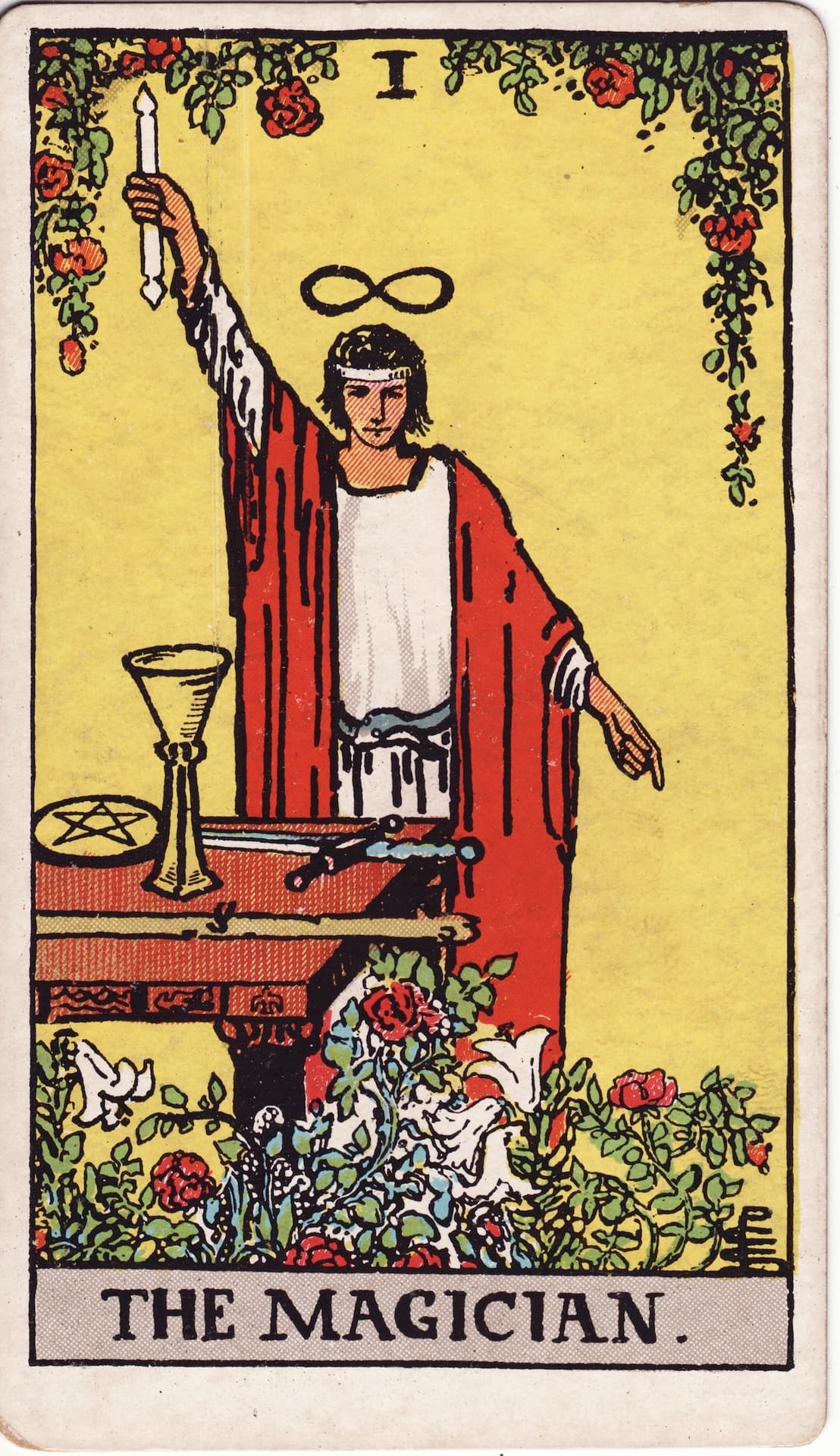 The Magician (Rider–Waite tarot): one hand raised to the heavens, one pointing to the earth — as above, so below.